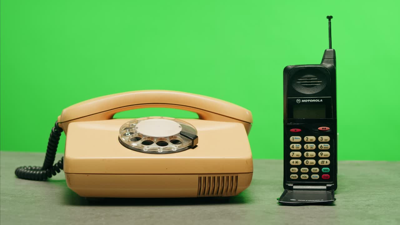 Retro vintage phone, A yellow rotary telephone is displayed on a wooden desk, adding a nostalgic touch