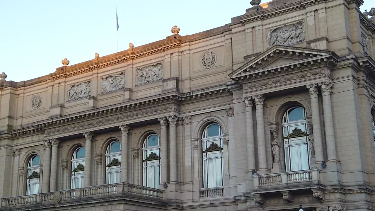 Panoramic of Colon Theater, Opera House building of Buenos Aires City, classic of Argentina in Sunset Skyline with National flag