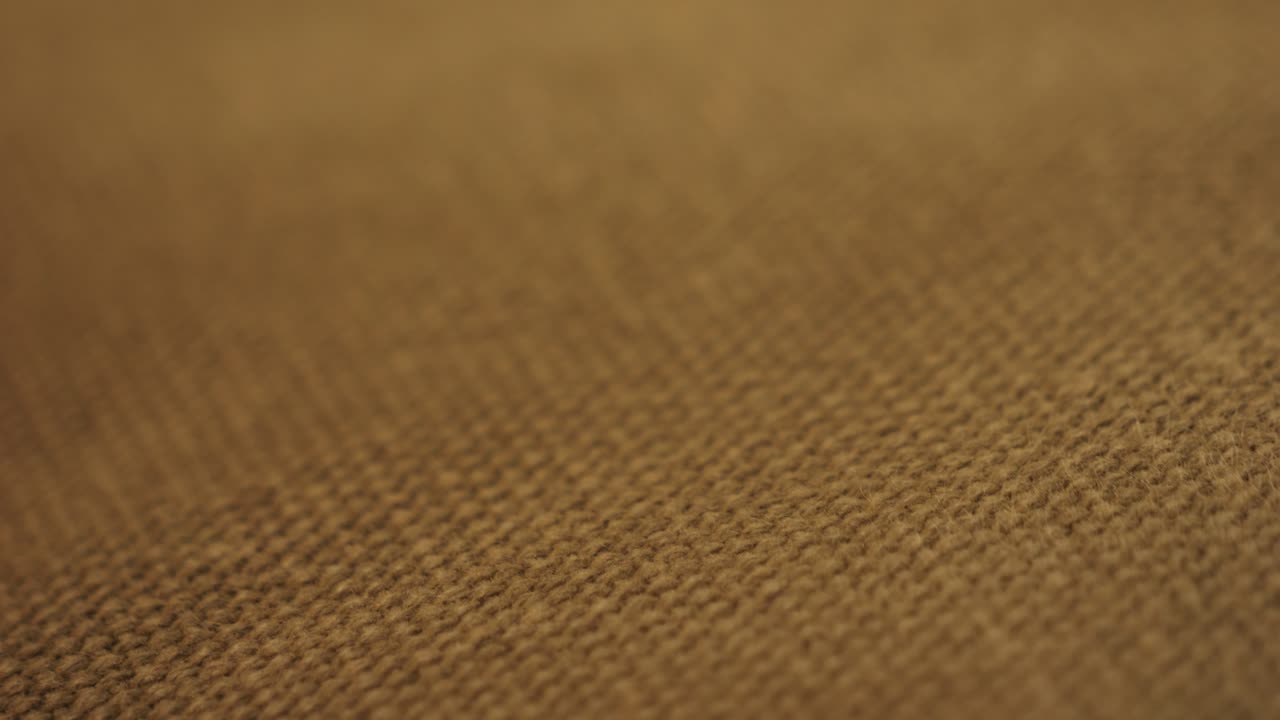 Brown fabric cloth texture background, seamless pattern of natural textile. High quality 4k footage