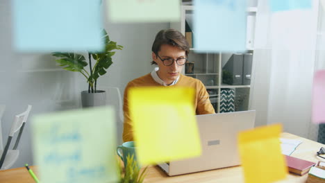 person working on a laptop in an office setting
