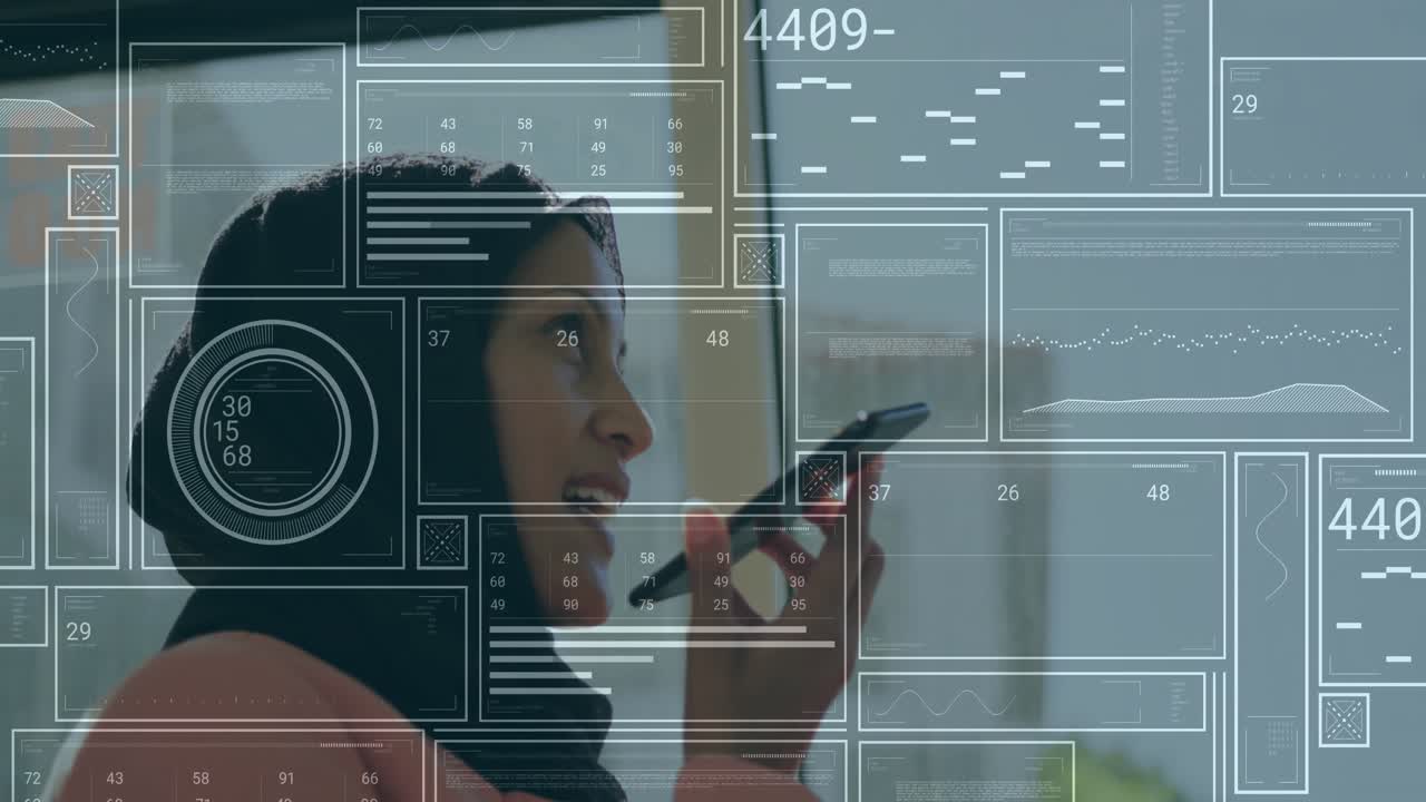 Woman bringing smartphone to mouth and dictating command in office, animating technology data chart