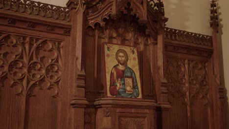 wide tilt down of a wooden tabernacle in a church