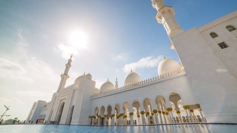 day light famous abu dhabi grand mosque down to top sunny sky panorama 4k time lapse uae