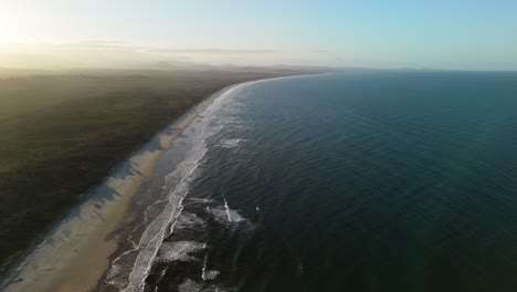sunrise over byron bay beach in australia