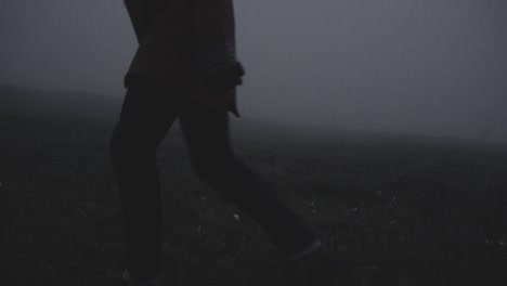 silhouette in abandoned icelandic canyon in a foggy, moody, dramatic landscape