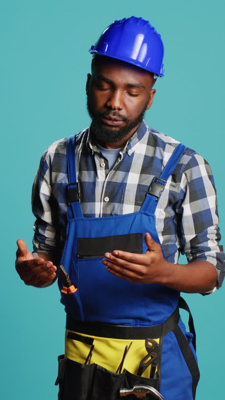 Vertical video: Wobbly repairman feeling light headed on camera