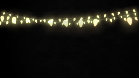 animation of string of fairy lights with copy space on black background