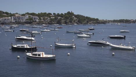 white boats in the ocean, coast town, costa brava, spain, static shot