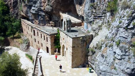 tourists visit the historic mar lichaa monastery in kadisha valley, bsharre, lebanon