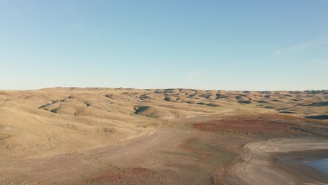 cinematic aerial shot of vast area of hills in south dakota