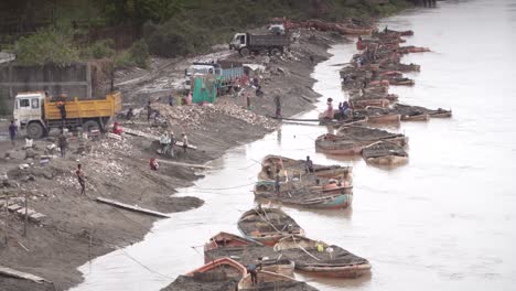 manual sand extraction operations on a river