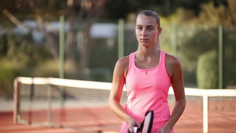 young woman tennis player on court