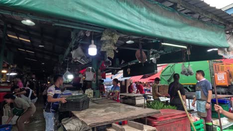 workers cleaning up a busy market area