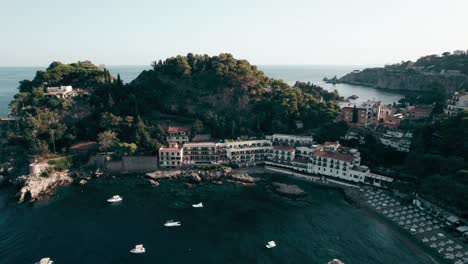 Aerial-view-of-Taormina,-Isola-Bella-in-Sicily,-Italy