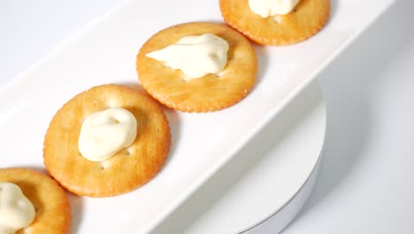 round crackers with mayonnaise