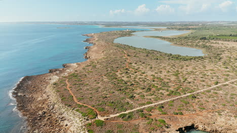 flying towards the pantano piccolo and vendicari wildlife reserve oriented nature reserve in summer in syracuse, sicily, italy