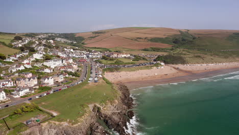 aerial flyover of a golden sandy beach on a summer’s day