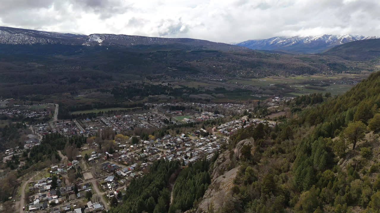 Descending Drone Shot of Andes Mountains Towards San Martín de los Andes City, stunning view of nature and city