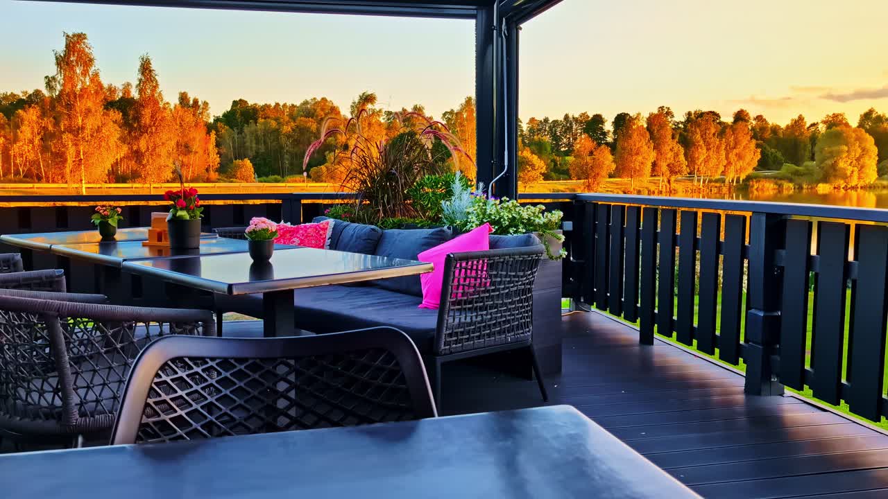 Outdoor Dining Area with Lake View at Sunset