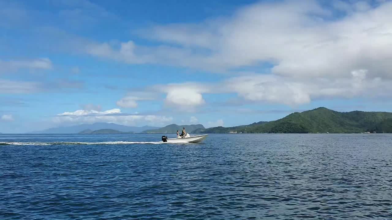 Footage of boat passing by while on another boat on the beautiful island of Trinidad and Tobago.