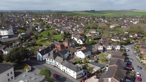 aerial drone static shot over rural suburb village housing estate in exeter, england