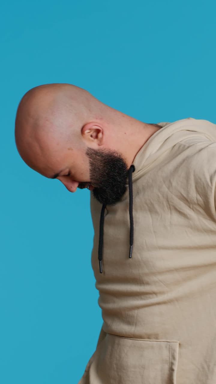 Vertical Video Middle eastern model dealing with lower back pain