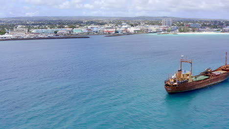 Old,-rusty-cargo-ship-in-Barbados,-Bridgetown-docked-in-Carlisle-Bay