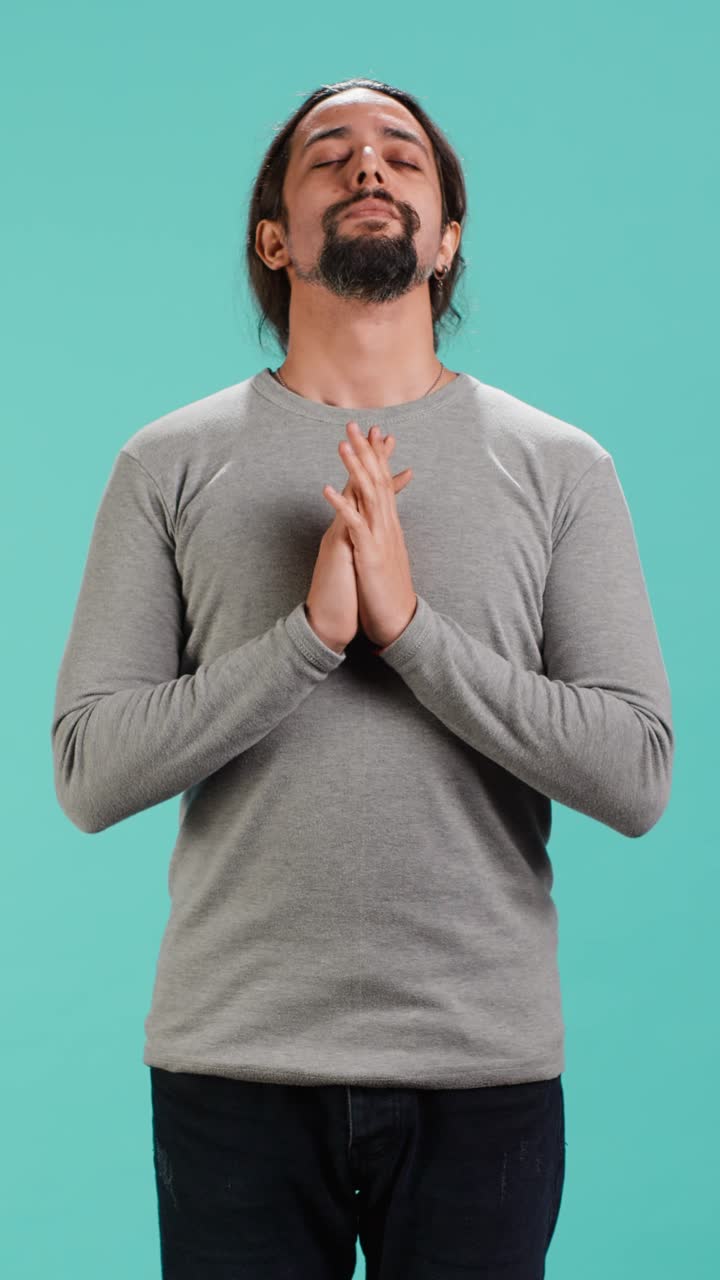 Vertical video Zen spiritual man doing worship hand gesturing