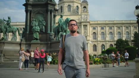 man walking through a european city