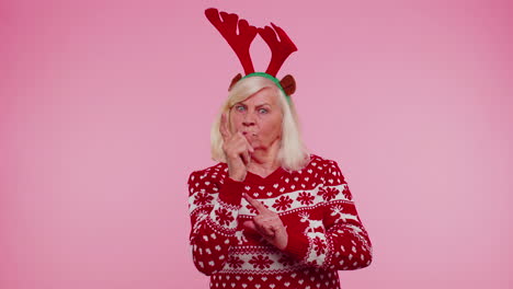 Displeased-senior-Christmas-old-woman-gesturing-hands-with-displeasure,-blaming-scolding-for-failure