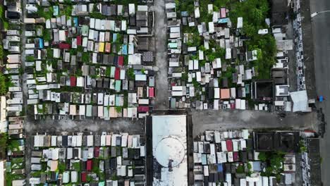 aerial top-down view of empty, overgrown catholic cemetery in catanduanes, philippines