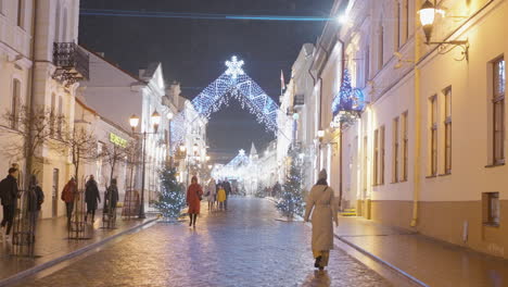 christmas decorated european city street at night