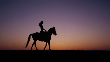 woman riding horse at sunset silhouette