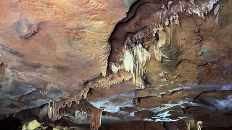 intricate cave formations with stalactites and mineral deposits