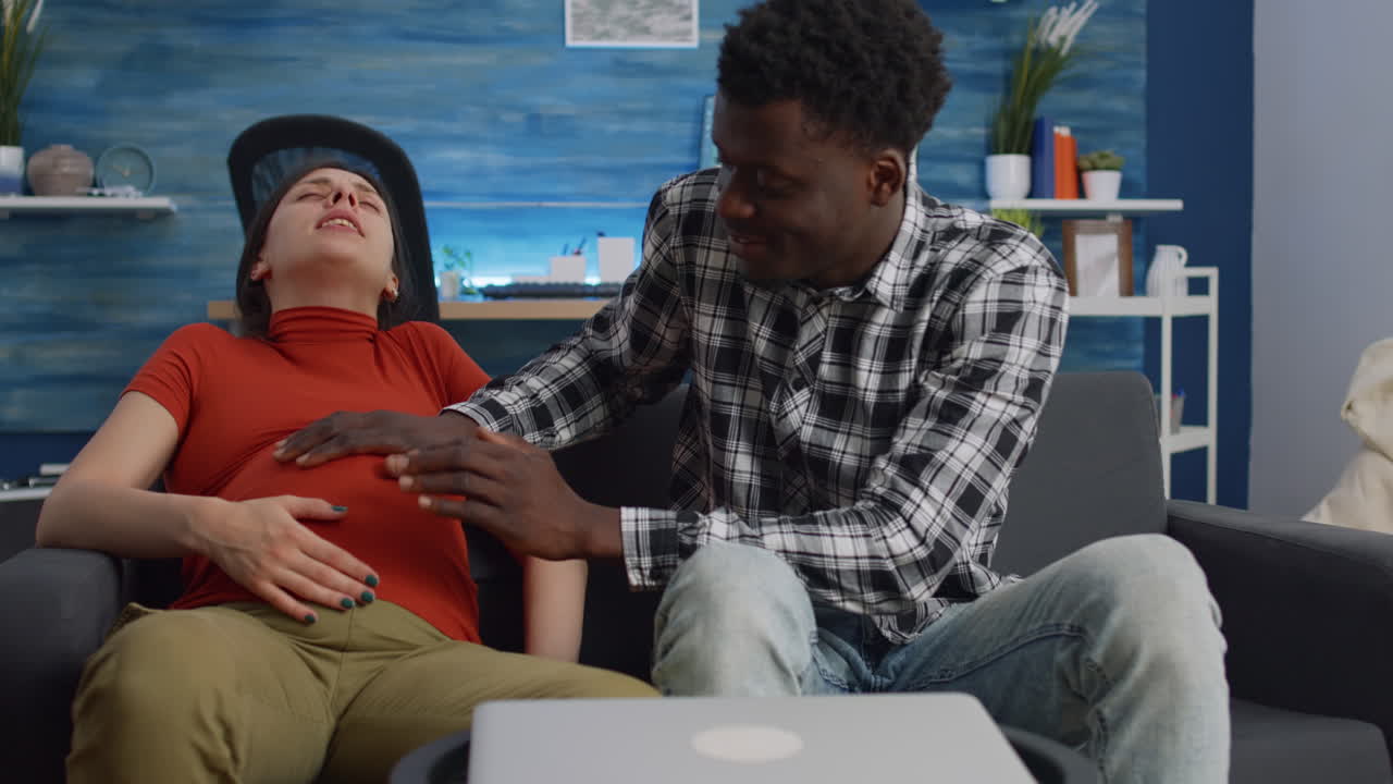 Interracial couple bonding while waiting for baby