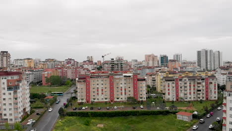 aerial city view with apartments houses and traffic on the roads on a winter day