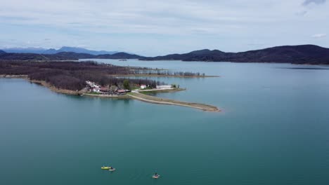 small peninsula with a cafe in lake plastira, central greece