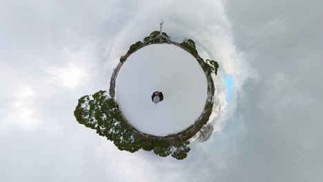 360-degree, little planet of snowing winter park. p.o.v shot.