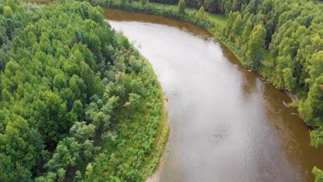 4k drone video of chena river cutting through forest near fairbanks, alaska