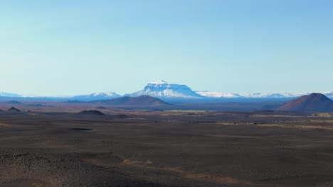 Aerial-establishing-shot-of-the-vast-Icelandic-landscape-with-a-large-volano