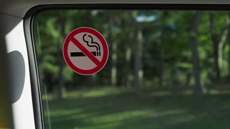 no smoking sign on car window