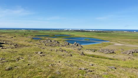 hvalfjarðarsveit flat inland grassland landscape with pools on iceland nature reserve