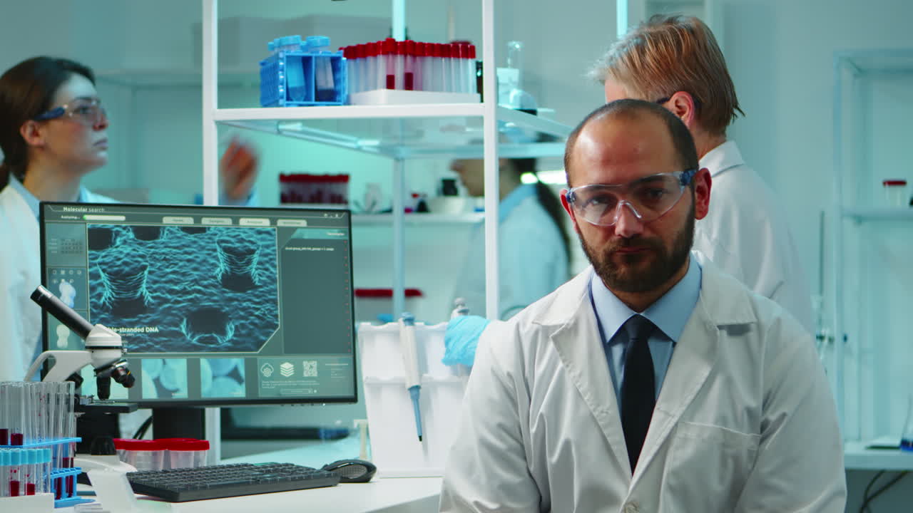 Portrait of exhausted chemist looking at camera