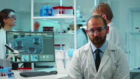 Portrait-of-exhausted-chemist-looking-at-camera