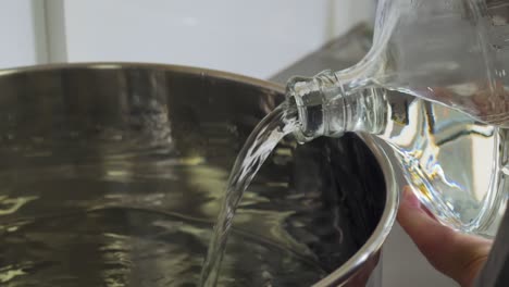 this is alcohol being poured into a gin distillery.