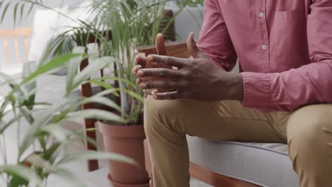 Midsection-of-african-american-male-patient-in-therapy-session,-slow-motion