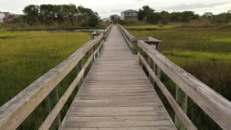 moving down the boardwalk across the marsh