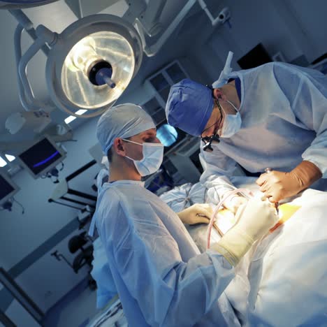 modern equipment in operating room. spine surgery. group of surgeons in operating room