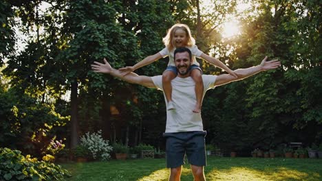 happy father and daughter in the garden
