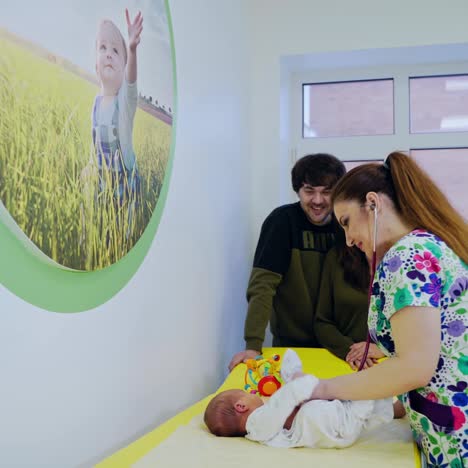 pediatrician with stethoscope listening children. female pediatrician examines baby with stethoscope